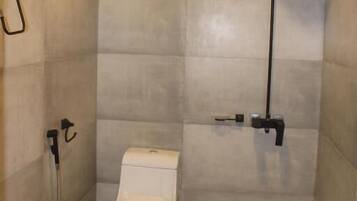 Shower, free toiletries, slippers, towels