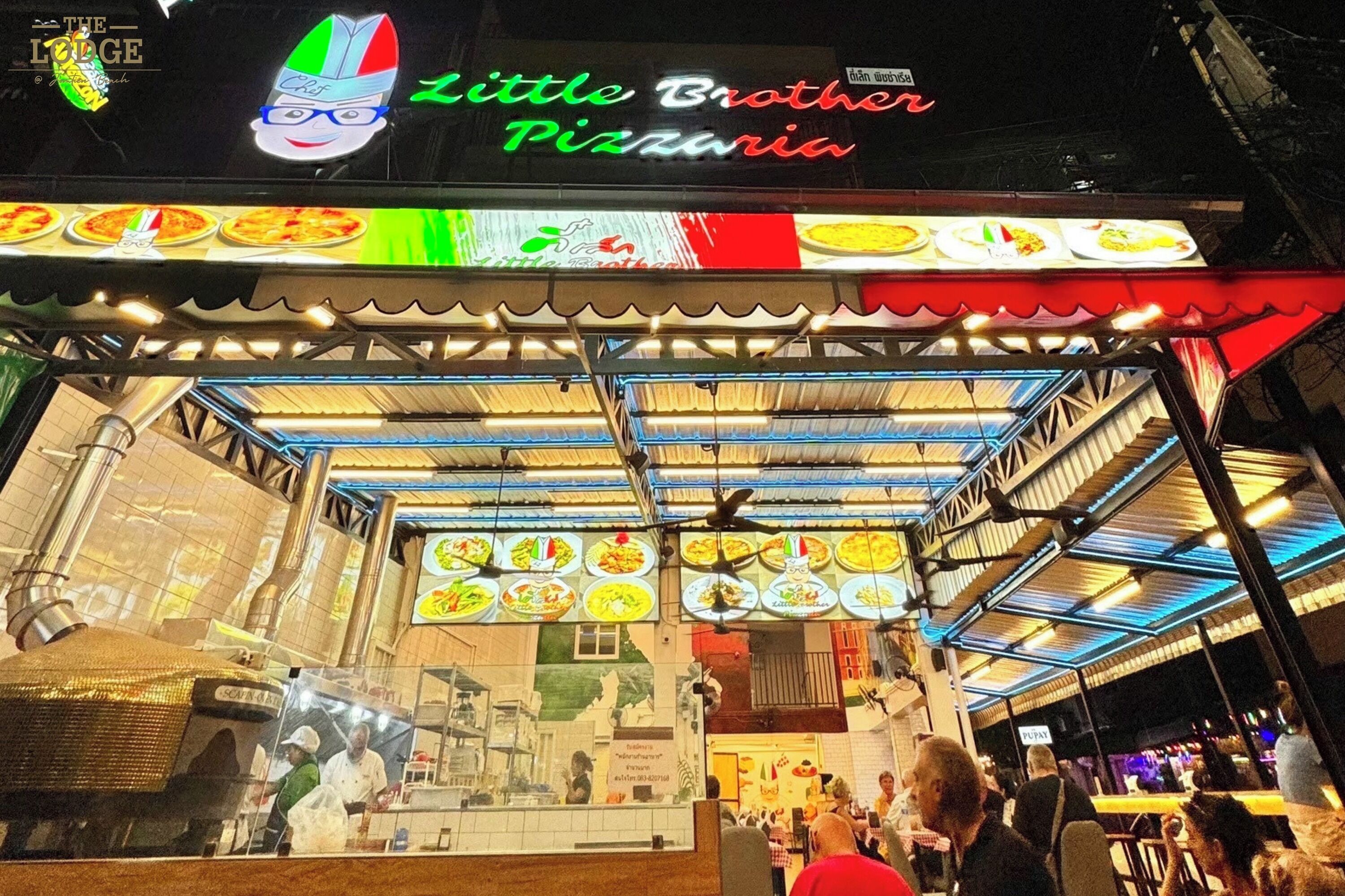 A Little Brother Pizzeria with a colorful sign and menu display.
