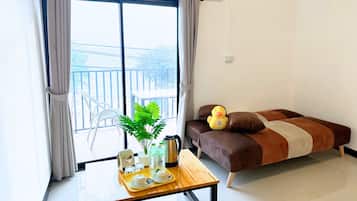 Deluxe Room, Balcony, Sea View | Minibar, in-room safe, desk, free WiFi
