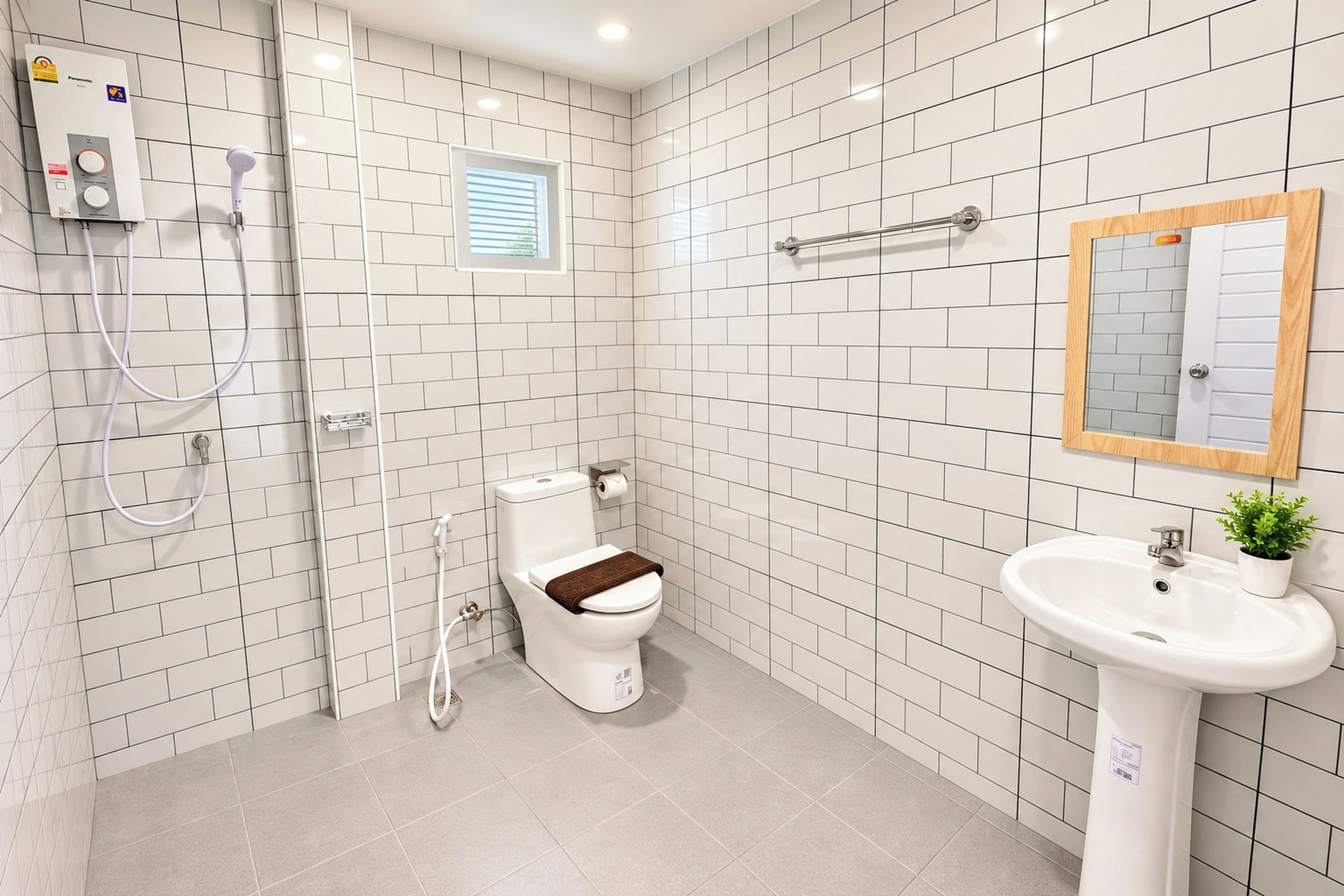 A bathroom with white tiled walls, a toilet, a sink, and a shower.