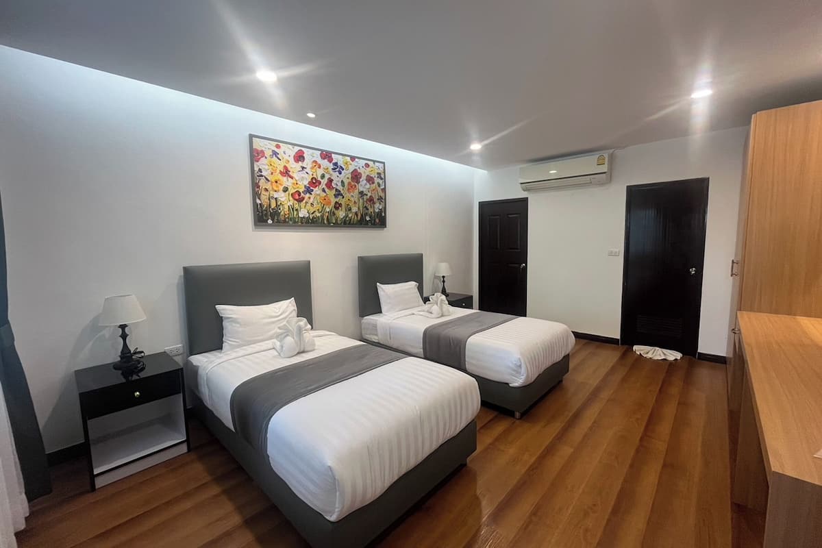 Chambre Deluxe avec lits jumeaux | Bureau, Wi-Fi gratuit