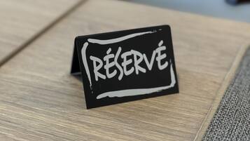 A black sign with the word "RESERVE" written on it.