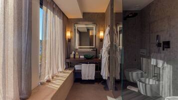 Junior Suite, Partial Sea View | Bathroom | Shower, rainfall showerhead, designer toiletries, hair dryer