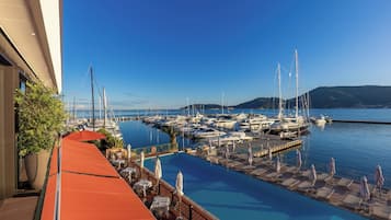 Outdoor pool, open 9:00 AM to 7:00 PM, pool umbrellas, sun loungers
