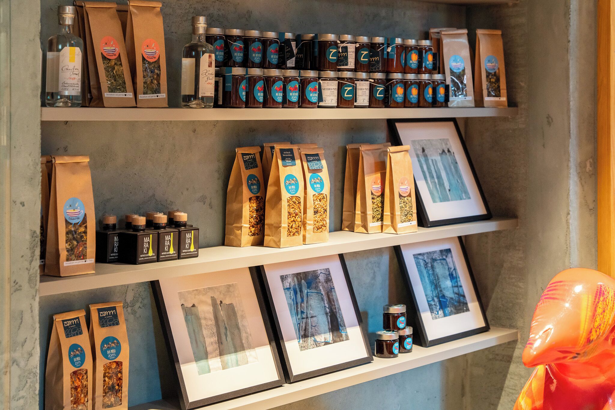 Shelves with various packaged goods, including jars and bags, likely for sale or display.