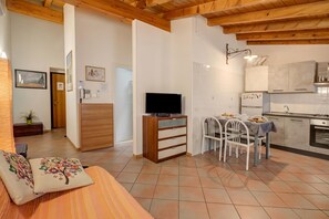 Family Apartment, Multiple Bedrooms (Casa Arx) | Living area | 21-inch Smart TV with cable channels