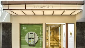 The exterior of The Hayworth hotel with a large advertisement window and a clear entrance. - V Causeway Bay (Hong Kong)