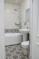 Deluxe Double Room | Bathroom | Rainfall showerhead, designer toiletries, hair dryer, bathrobes