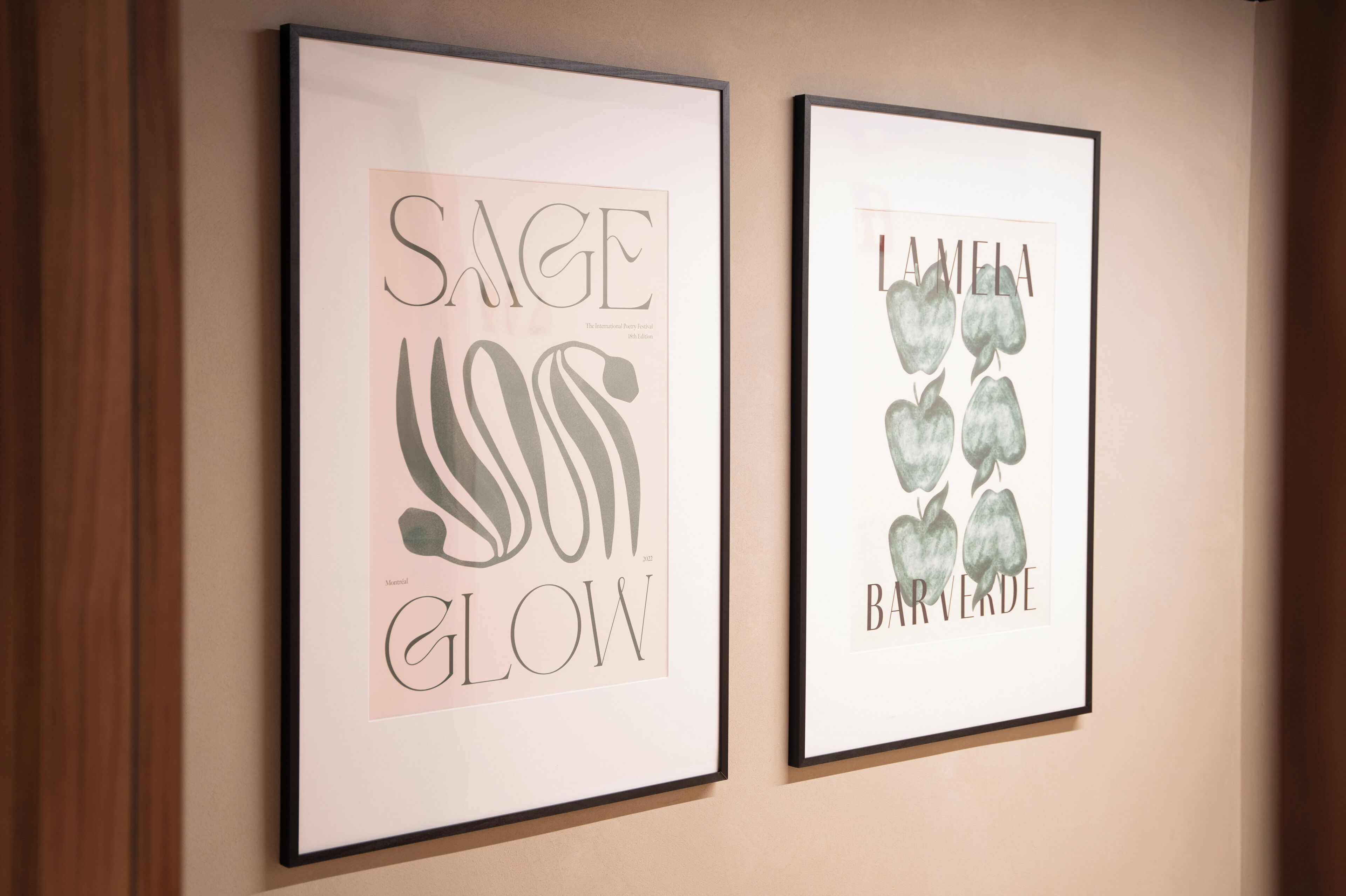 Two framed artworks on a wall.