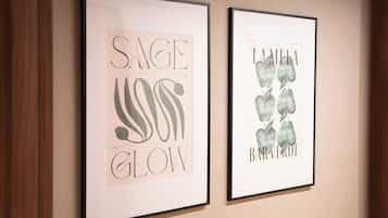 Two framed artworks on a wall.