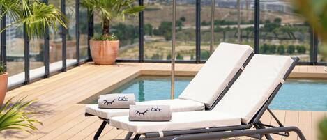 Outdoor pool, pool umbrellas, pool loungers