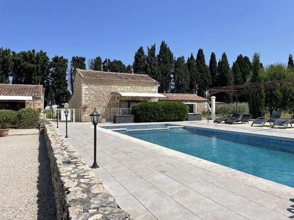 Seasonal outdoor pool, pool loungers