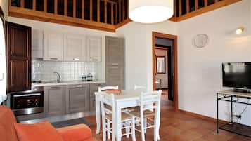 Basic Apartment, Sea View | Living area | Flat-screen TV