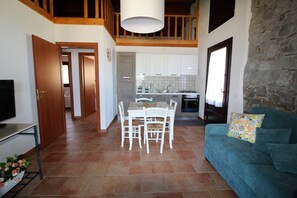 Deluxe Apartment, Sea View | Living area | Flat-screen TV