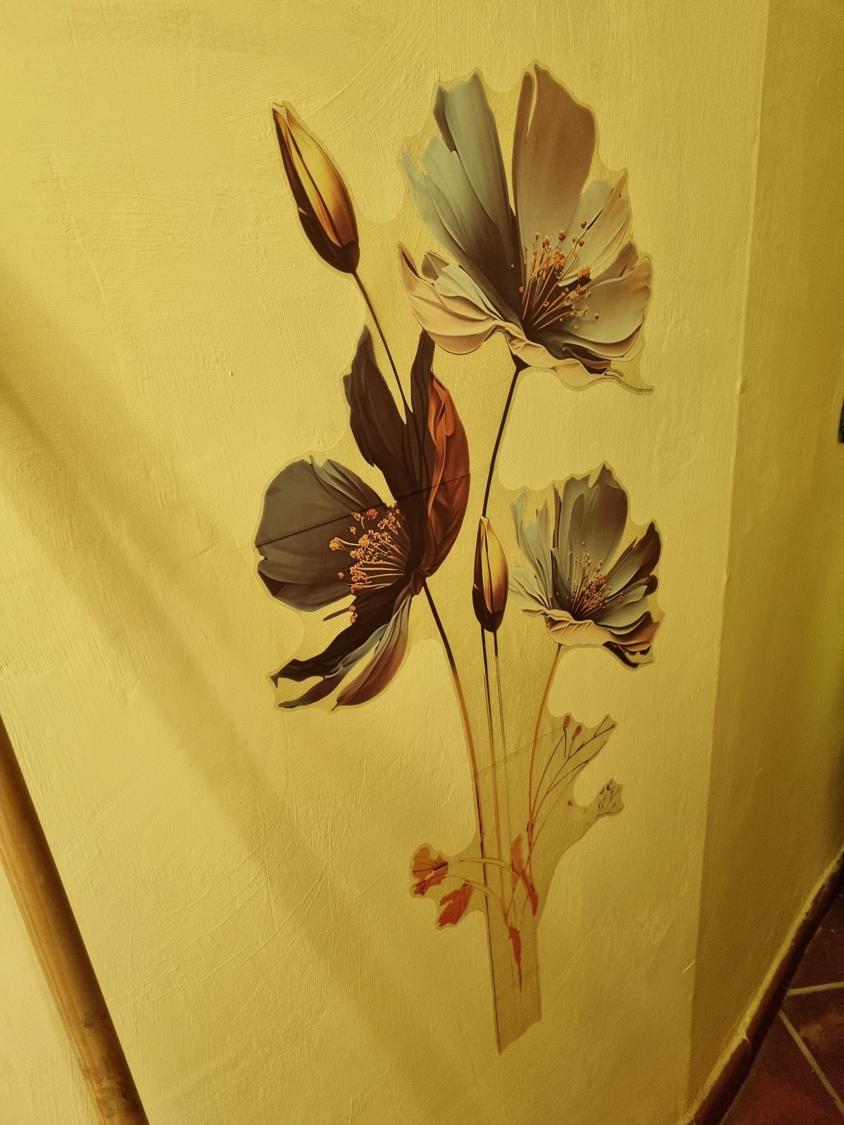 A wall with a floral mural.