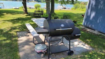 Enjoy al fresco dining with a gas grill and picnic table overlooking the serene lake.