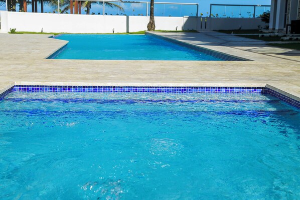 Outdoor pool, open 8:00 AM to 6:00 PM, pool loungers