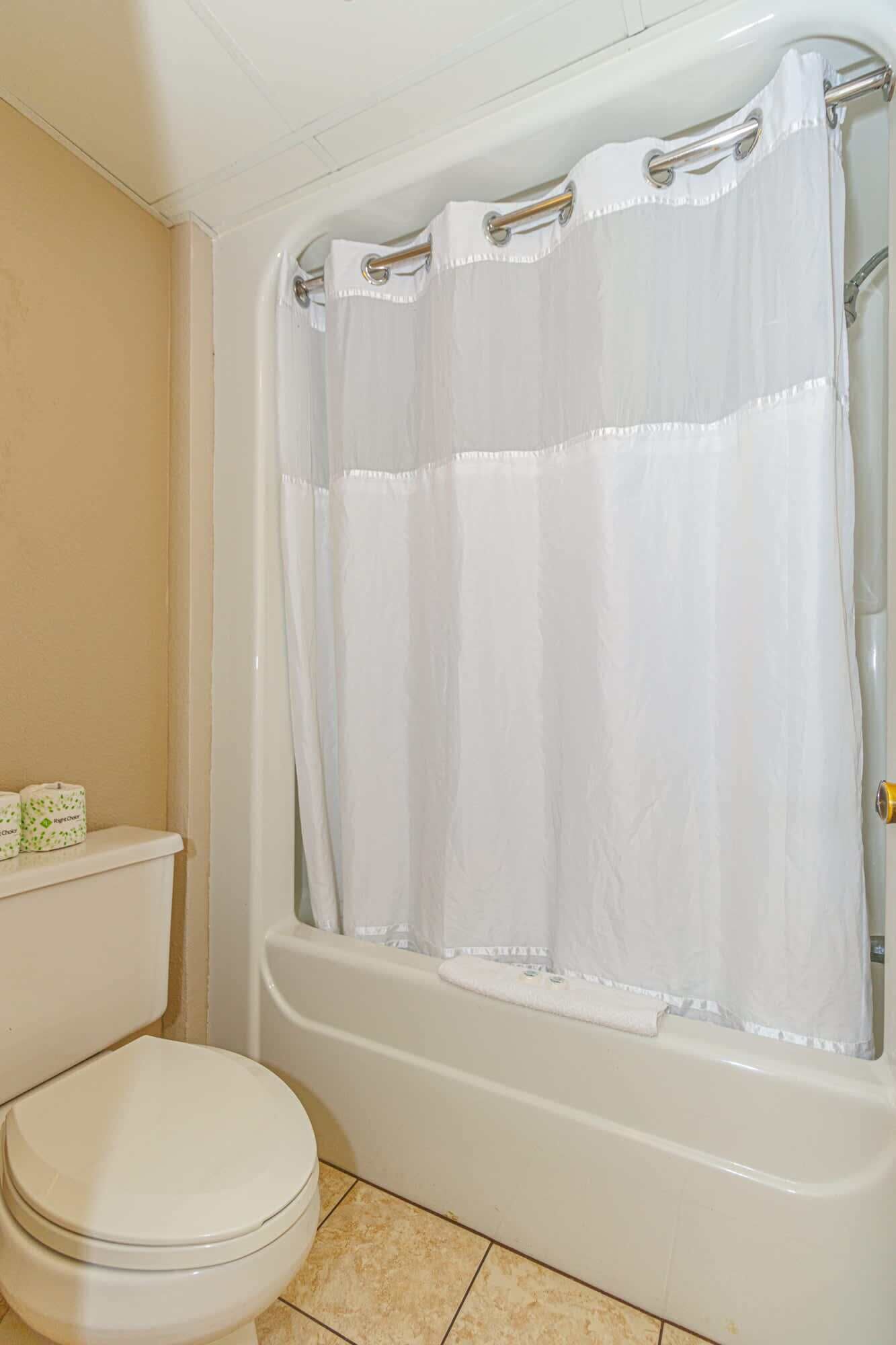 Shower, hair dryer, towels, shampoo