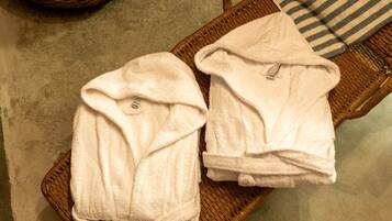 Two white towels on a wicker tray.