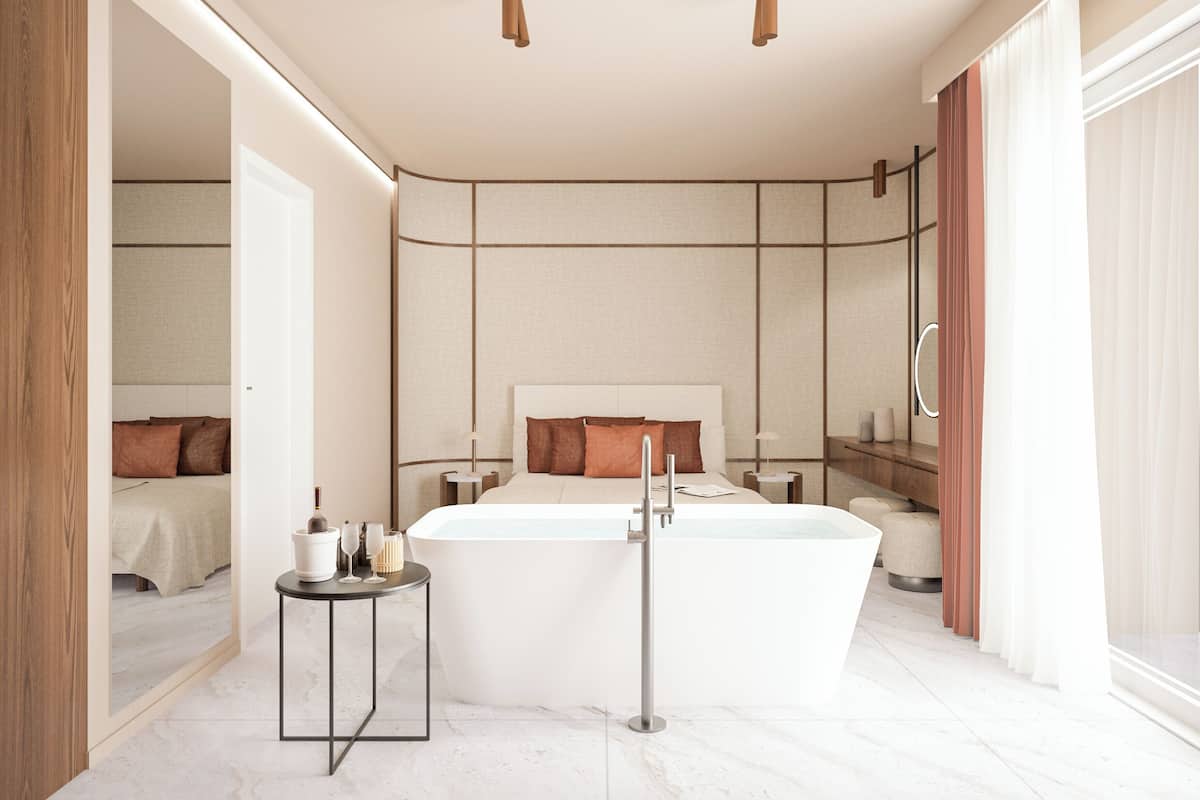 Ein modernes Badezimmer mit einer freistehenden Badewanne, einem kleinen Nachttisch und einem Spiegel.
