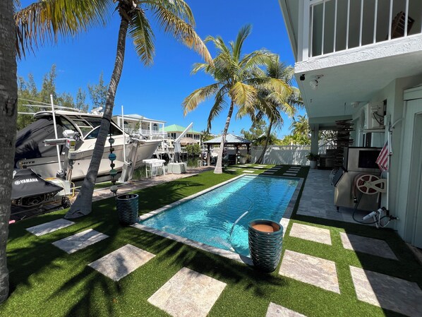 Outdoor pool, a heated pool - Spacious 4-bedroom vacation home minutes to John Pennekamp Coral Reef State Park (Key Largo)
