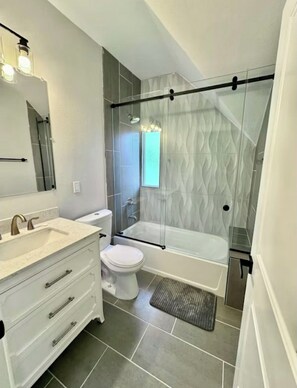 Shower, hair dryer, towels, soap