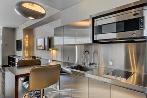 Fridge, microwave, blender, cookware/dishes/utensils