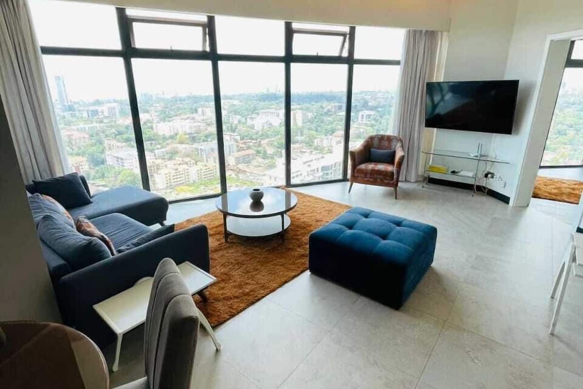 Business Apartment | Living area | 24-inch Smart TV with digital channels