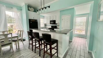 Coffee/tea maker, fridge, microwave, oven