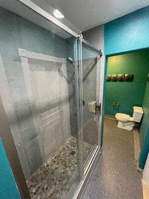 Shower, hair dryer, towels, soap