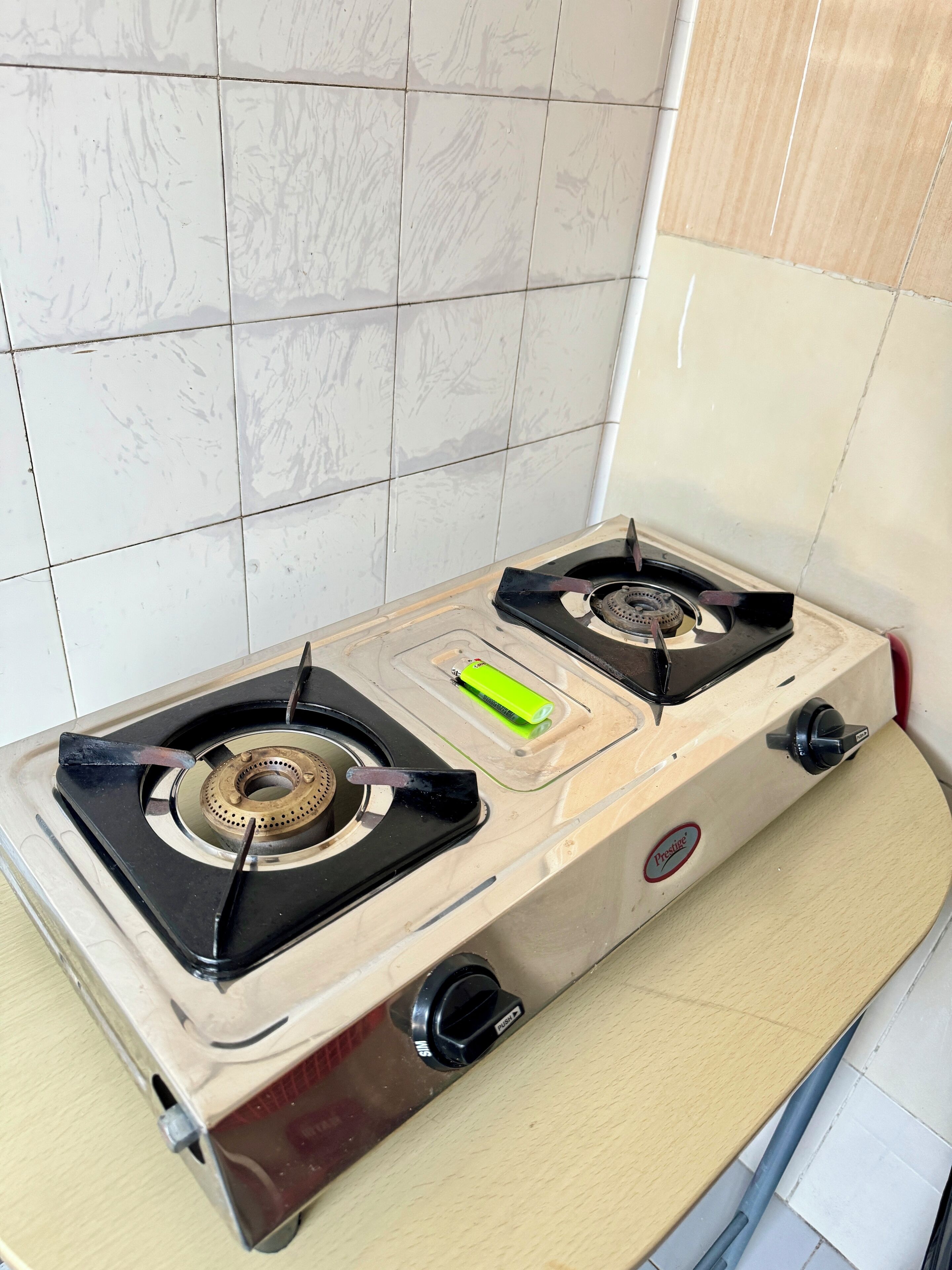 A kitchen with a gas stove and a sink.