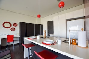 Fridge, microwave, stovetop, coffee/tea maker