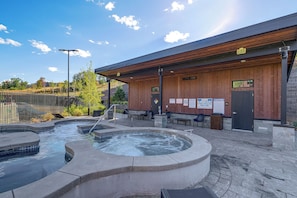 A spa area with hot tubs and a wooden building with an exit sign. - Ski-In/Ski-Out Resort Studio w/ Views in Park City (Park City)