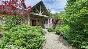 A house with a stone foundation, wooden beams, and a front porch. - Water Views! Group-Friendly Lake Glenville Home (Cullowhee)