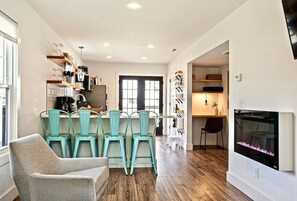 Smart TV, fireplace, books, printers