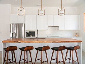 Fridge, microwave, oven, stovetop - Luxe Modern Home with Ocean Views & Heated Pool (Jacksonville Beach)