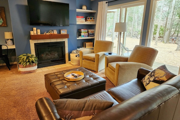 Spacious living room with plenty of comfy seating for everyone