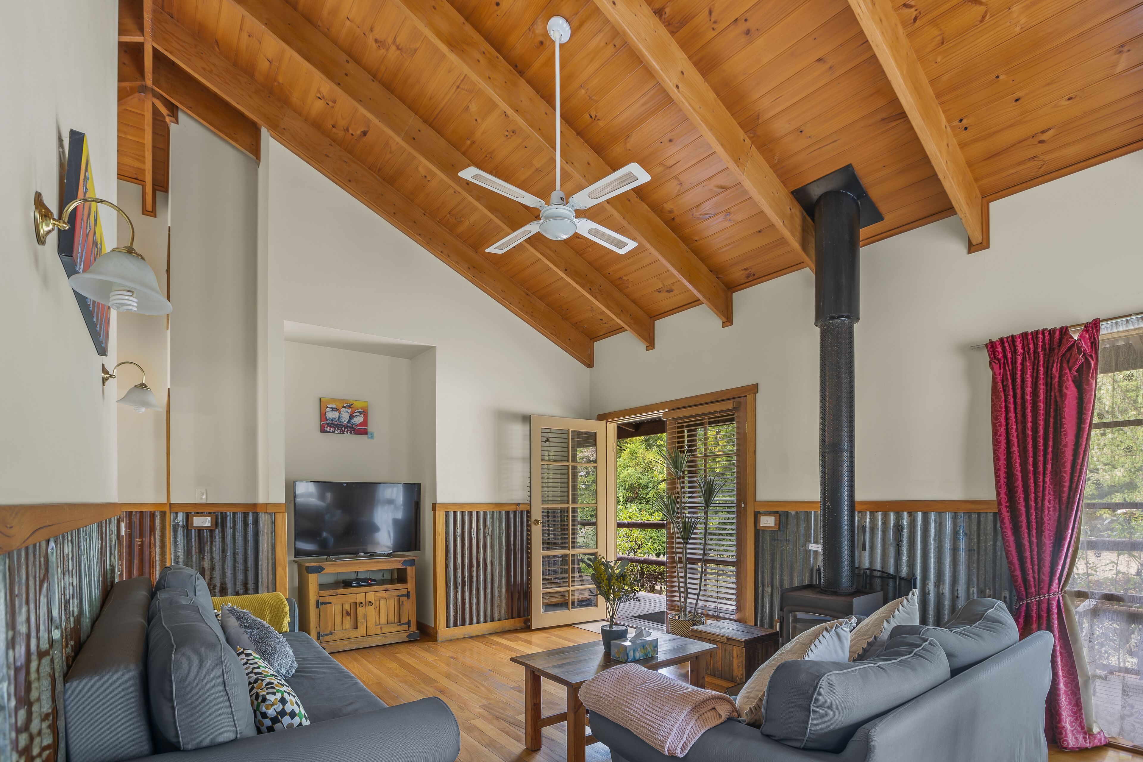 Traditional Cottage, Partial Lake View | Living room | 50-inch LED TV with cable channels, fireplace, DVD player