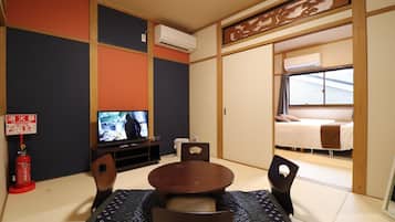 City Townhome, Non Smoking | Living room | Flat-screen TV