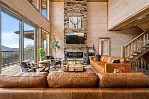 Kick your boots off after a long hike and sink in by the fireplace — the great room is where the whole group lands at the end of every fall day.