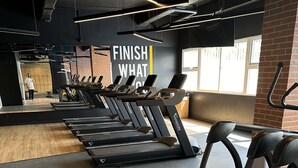 A gym with treadmills, a mirror, and a motivational sign. - Located in Zona 11, centrally-located,  family friendly, near airport, near mall (Guatemala City)