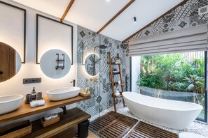 Villa | Bathroom | Separate tub and shower, towels, soap, shampoo