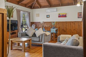 Traditional Cottage | Living room | 50-inch LED TV with cable channels, fireplace, DVD player