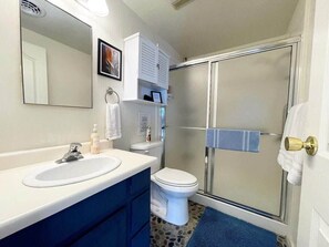 Shower, hair dryer, towels, shampoo