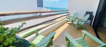 Apartment with mountain view, private balcony and access to beach front terrace.