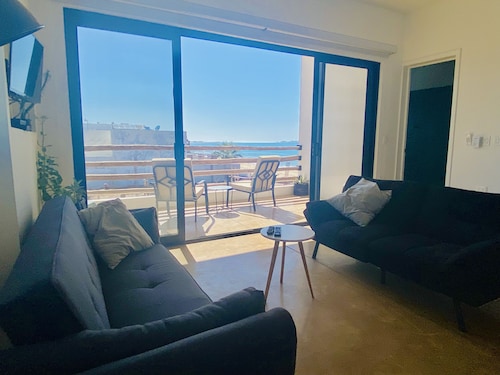 Apartment with mountain view, private balcony and access to beach front terrace.