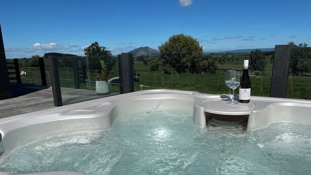 A hot tub with a clear view of a mountainous landscape in the background. - Panoramic mountain and rural views - central to key destinations
 (Te Awamutu)