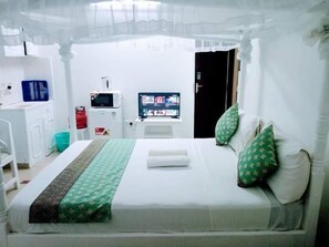 Deluxe Studio | Living area | 24-inch Smart TV with digital channels