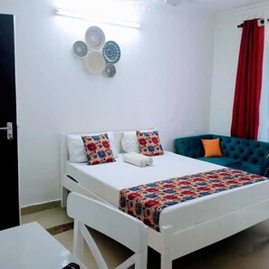 Comfort Studio | Living area | 24-inch Smart TV with digital channels - Bustani Studio Apartments Nyali (Mombasa)