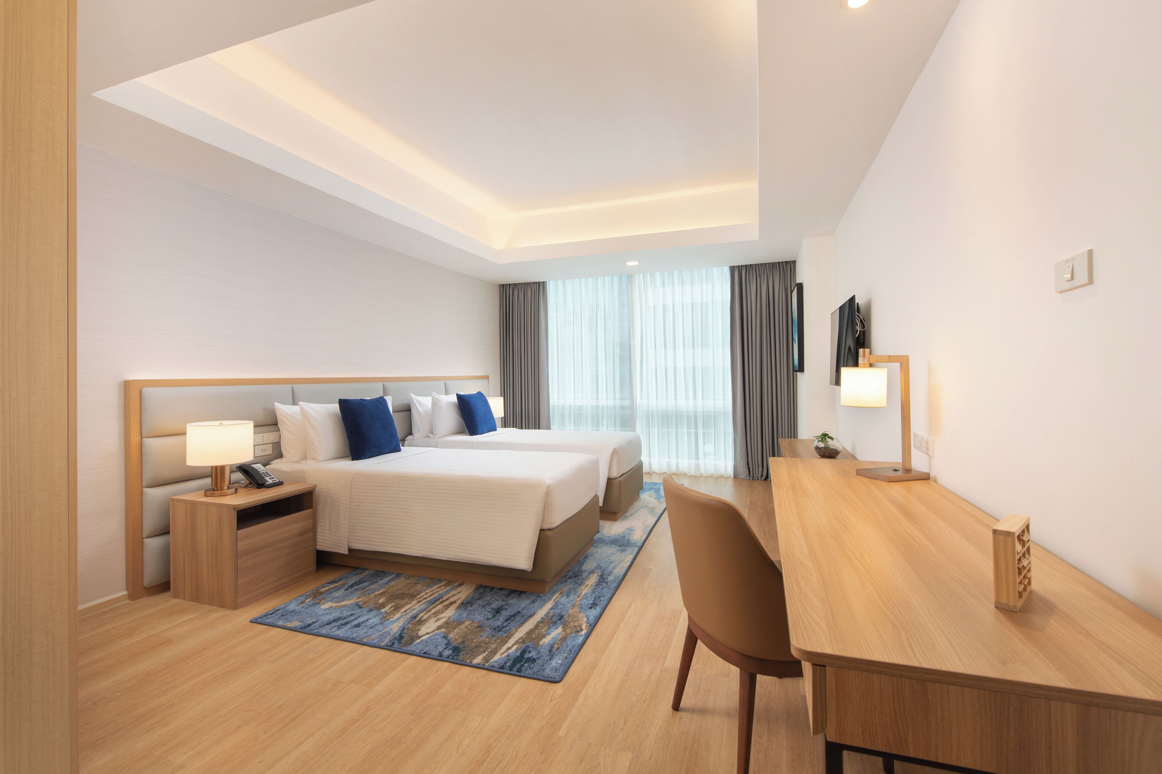 Deluxe Room, 3 Bedrooms | In-room safe, desk, laptop workspace, blackout curtains